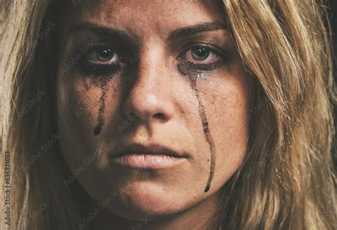 Sad abused woman with brown eyes crying, parting with your loved one. 4K . Sick Sad Child, Stressed Unhappy Kid, Ill Girl in Depression, Abused Person. 4K 